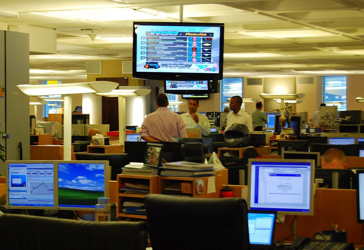 Analysts at banks of screens showing price charts in the Standard Bank head office, Johannesburg